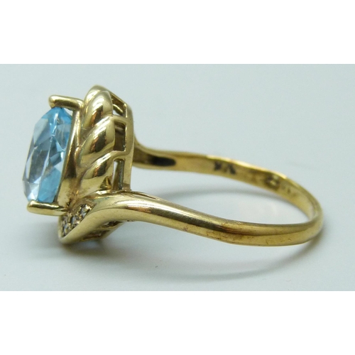 7074 - A 9k gold, topaz and diamond ring, 3.7g, N