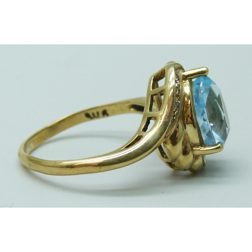 7074 - A 9k gold, topaz and diamond ring, 3.7g, N