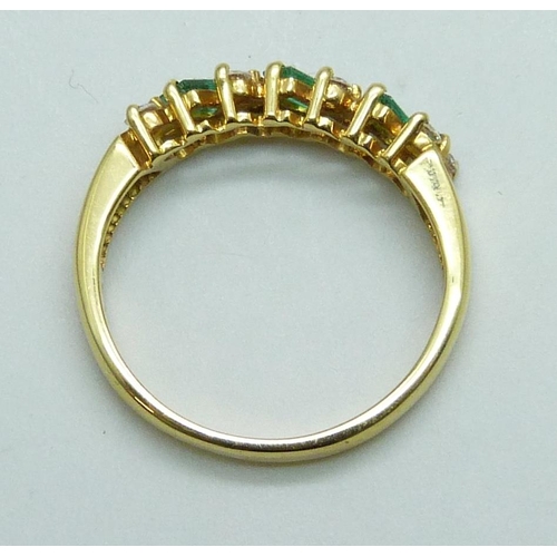 7075 - An 18ct gold, emerald and diamond ring, 0.25 ct marked in shank, 3.6g, M/N