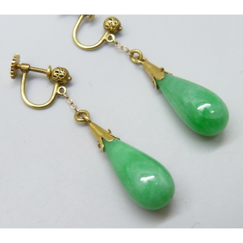 7080 - A pair of yellow metal mounted jade earrings, 3.8cm drop, 8g