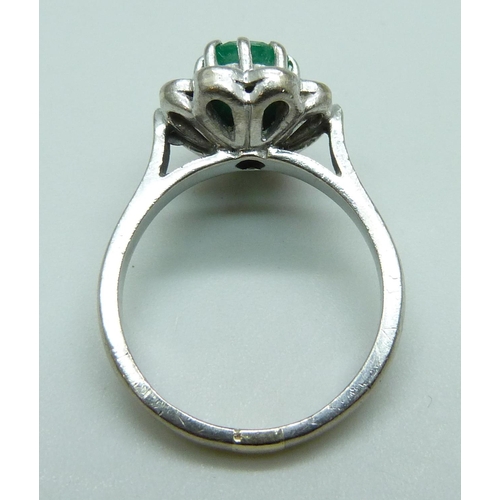 7082 - An 18ct white gold, emerald and diamond ring, approximately 0.7ct diamond weight, 7.4g, O/P