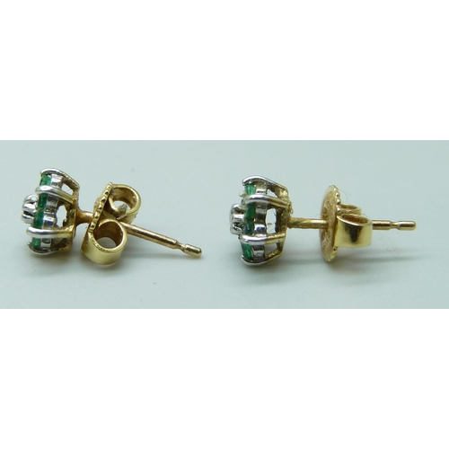 7083 - A pair of yellow metal, emerald and diamond cluster earrings, the butterflies marked 750 for 18ct, 1... 