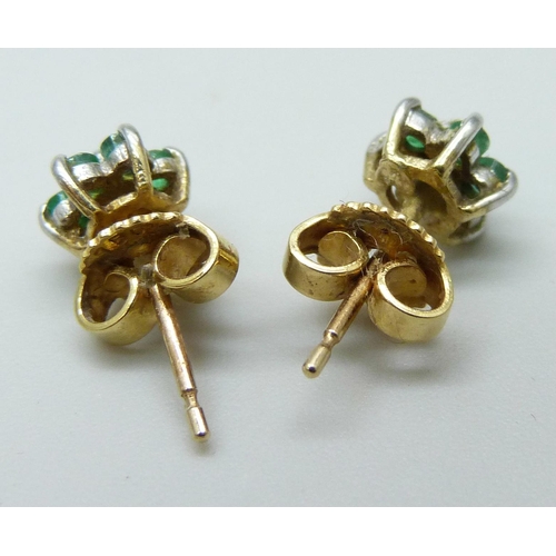 7083 - A pair of yellow metal, emerald and diamond cluster earrings, the butterflies marked 750 for 18ct, 1... 