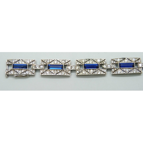 7085 - A French silver Art Deco bracelet set with paste stones, 32g, 17.8cm, 1.3cm wide