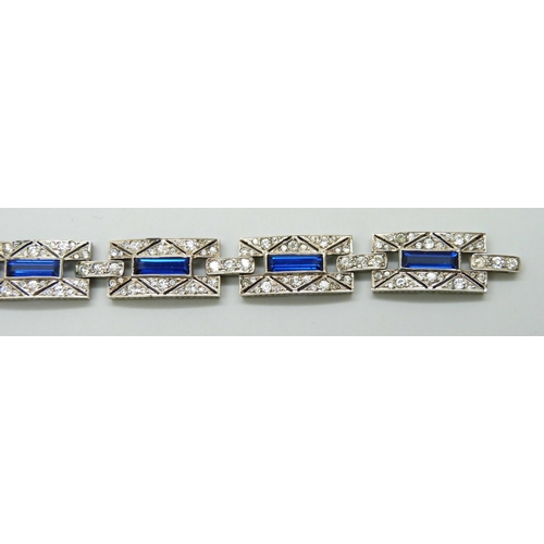 7085 - A French silver Art Deco bracelet set with paste stones, 32g, 17.8cm, 1.3cm wide