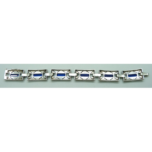 7085 - A French silver Art Deco bracelet set with paste stones, 32g, 17.8cm, 1.3cm wide