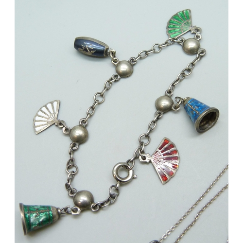 7087 - A white metal and enamel Art Nouveau pendant on a German sterling silver chain, 3.3cm drop, together... 