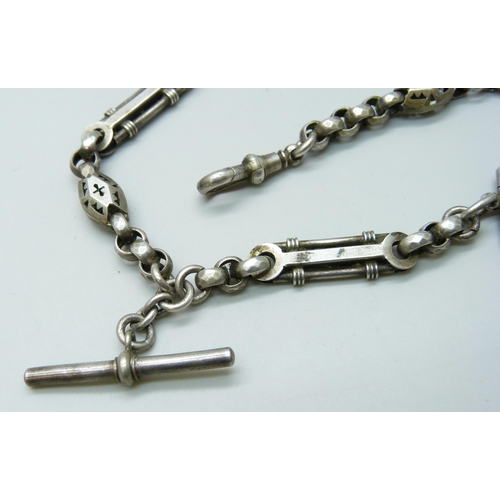 7089 - A Victorian white metal fancy link Albert watch chain, with a Victorian silver locket with enamelled... 