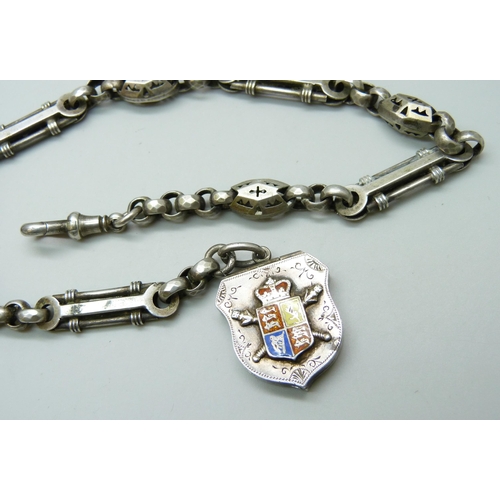 7089 - A Victorian white metal fancy link Albert watch chain, with a Victorian silver locket with enamelled... 