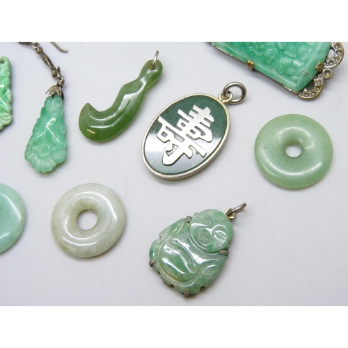 7095 - A collection of green stone jewellery including jade circles and other brooches, pendants and earrin... 