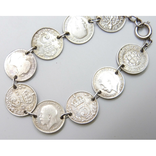 7106 - A silver 3d coin bracelet, some coins post 1920 half silver, 13g