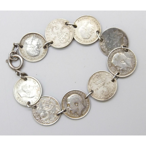 7106 - A silver 3d coin bracelet, some coins post 1920 half silver, 13g