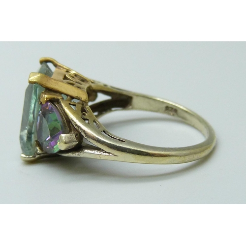 7107 - A silver gilt emerald cut green stone and mystic topaz ring, O