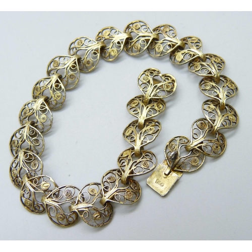 7109 - A .900 silver gilt Art Nouveau style filigree bracelet, 9.7g, 19cm