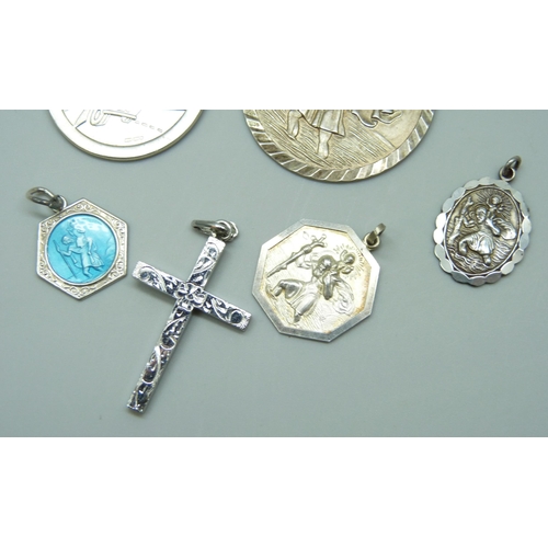 7126 - Five silver St Christopher pendants including a Georg Jensen enamelled example, and a silver cross, ... 