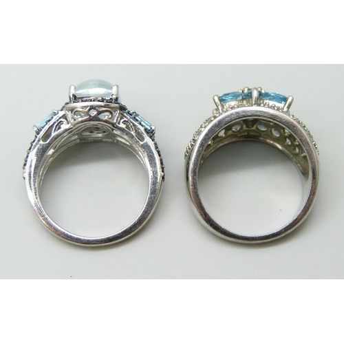 7128 - Two silver gem set rings, 12g total, both size N