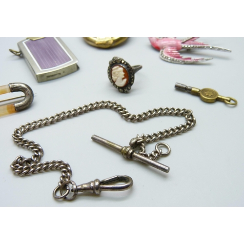 7133 - A collection of items including an Art Deco enamelled lighter/striker, a brooch in the form of a bir... 