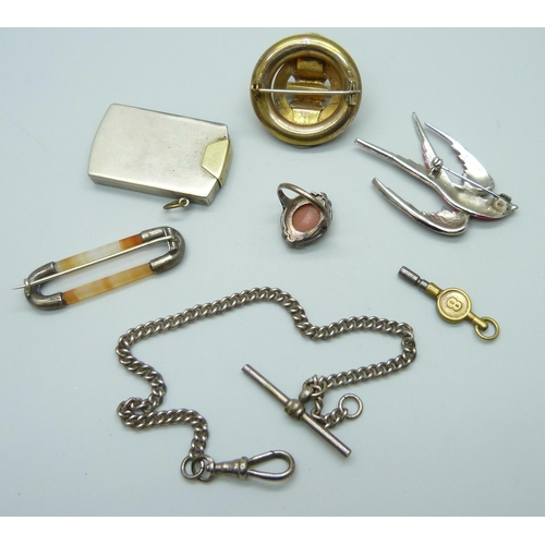 7133 - A collection of items including an Art Deco enamelled lighter/striker, a brooch in the form of a bir... 