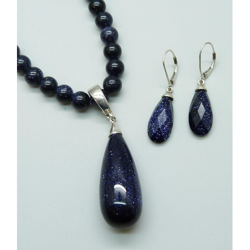 7135 - A Whitney Kelly silver mounted purple goldstone necklace and matching earrings, 65g total