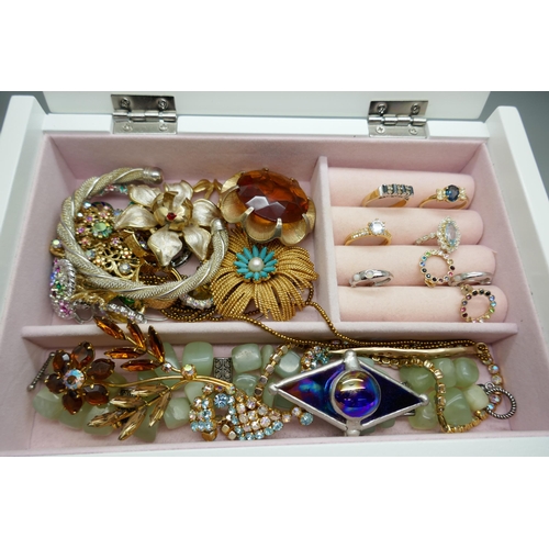 7146 - A jewellery box and contents including Hollywood and other brooches, Monet earrings, a silver bracel... 