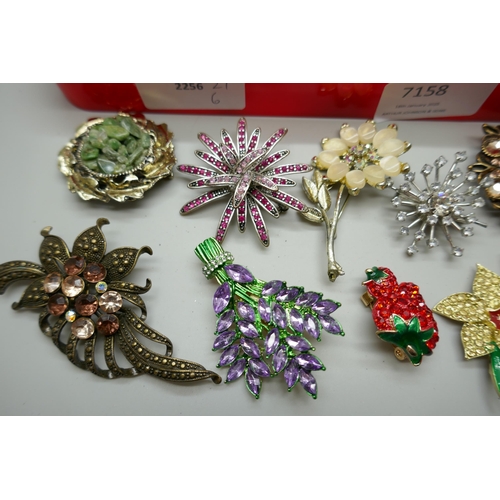 7158 - A collection of 52 costume brooches