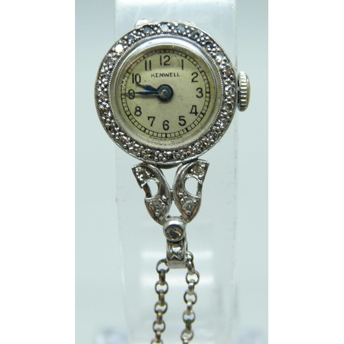 7188 - A palladium cased diamond set watch pendant on a silver chain with a silver cross pendant, 3.2g pall... 