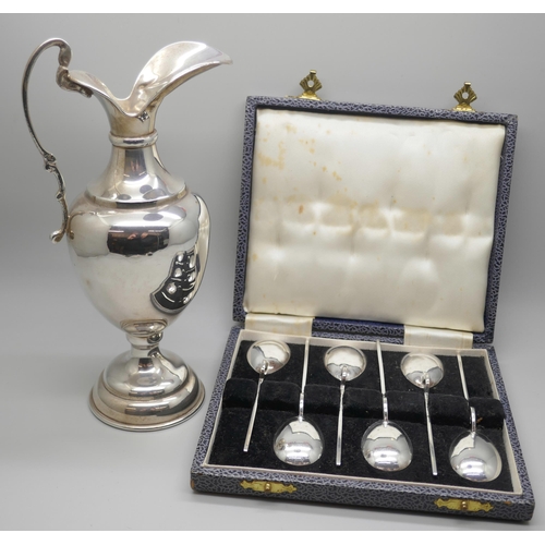 7231 - A set of six silver spoons, 56g, cased, and a silver jug with weighted base, stamped 925, 242g