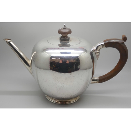 7234 - A silver teapot with wooden handle, London 1970,  620g