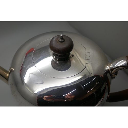 7234 - A silver teapot with wooden handle, London 1970,  620g