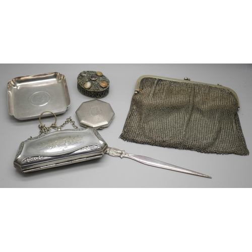 7244 - Two silver plated purses, an Eastern pot set with stones, a plated dish, compact, and a letter opene... 