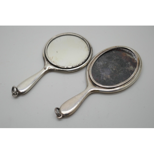 7247 - An engraved silver handbag mirror and another plain example, 7cm