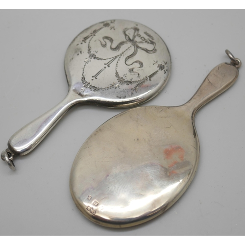 7247 - An engraved silver handbag mirror and another plain example, 7cm