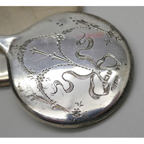 7247 - An engraved silver handbag mirror and another plain example, 7cm