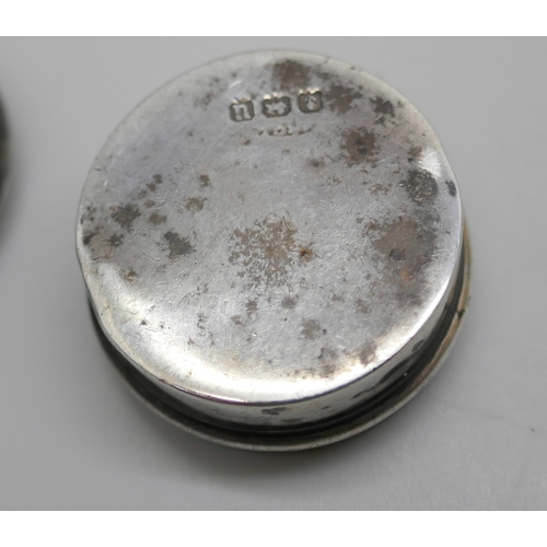 7249 - A Victorian embossed silver pill box, Birmingham 1895, another silver pill box, Birmingham 1919, and... 