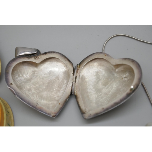 7252 - A silver heart shaped locket, a silver pendant set with a white stone, a silver tie bar, two pairs o... 