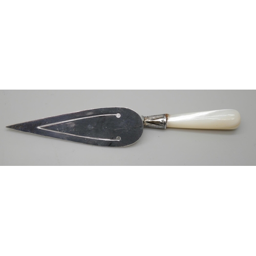 7256 - A silver bookmark with mother of pearl handle, together with two silver pill boxes and a white metal... 