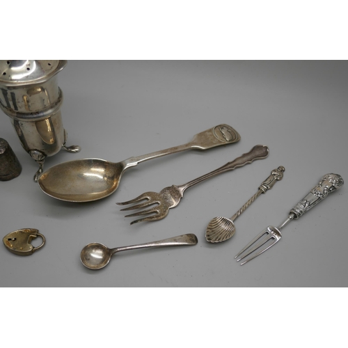 7258 - A collection of silver items including a pepper, spoons, fork, three thimbles, etc., 104g