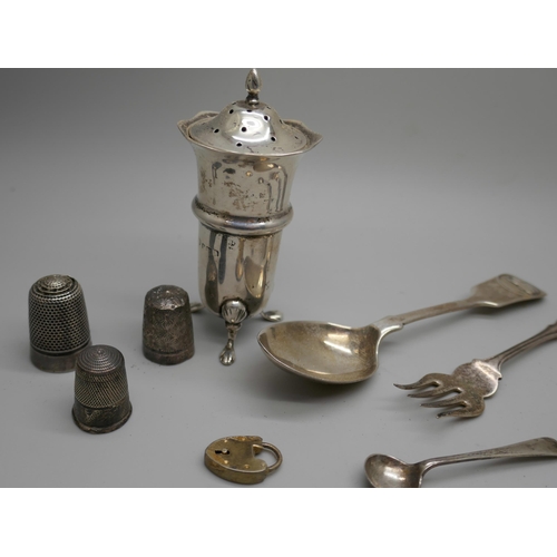 7258 - A collection of silver items including a pepper, spoons, fork, three thimbles, etc., 104g