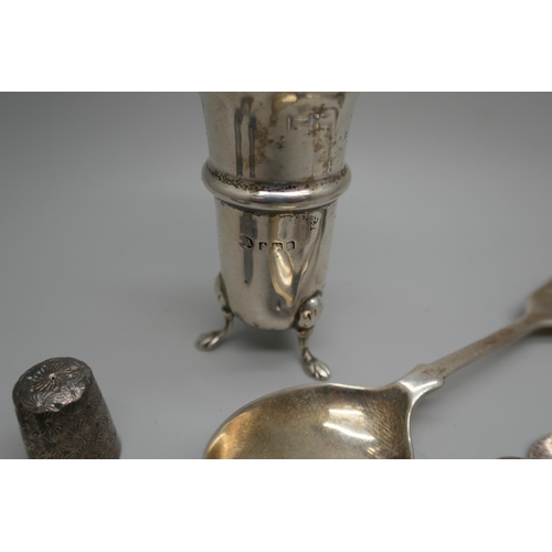 7258 - A collection of silver items including a pepper, spoons, fork, three thimbles, etc., 104g