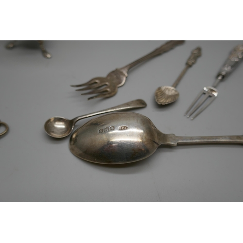 7258 - A collection of silver items including a pepper, spoons, fork, three thimbles, etc., 104g