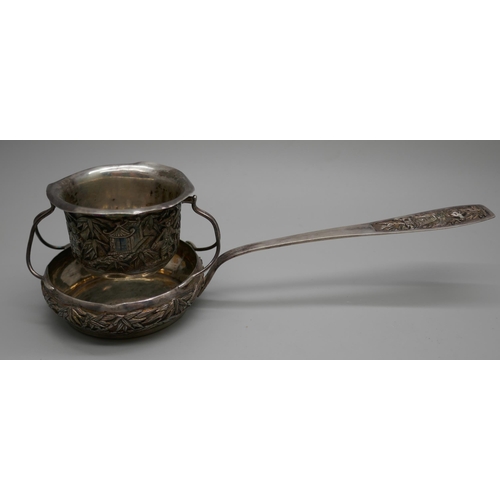 7260 - A white metal tea strainer with Chinese character marks to handle, 16cm, 64g