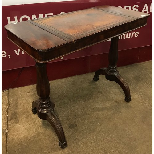 102 - A Victorian mahogany and leather topped adjustable writing table