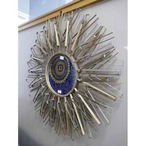 3063 - A large round metal mirror