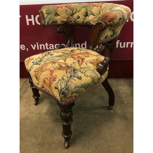 109 - A pair of Victorian walnut and fabric upholstered library chairs