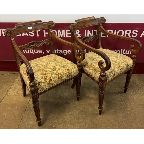 109 - A pair of Victorian walnut and fabric upholstered library chairs