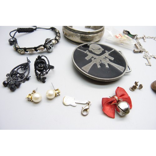 7148B - A silver bracelet with white metal charms, and other costume jewellery