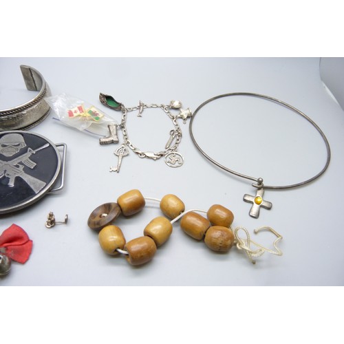 7148B - A silver bracelet with white metal charms, and other costume jewellery