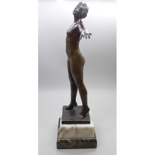 2001 - An Art Deco bronze figure of a female nude, on grey marble socle, 27.5cms h, one corner of the black... 