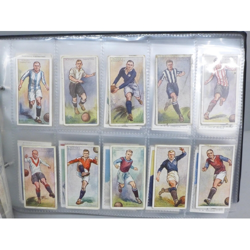 2017 - An album of sporting cigarette cards, including players 'Racing Caricatures', Footballers 1928, Cric... 