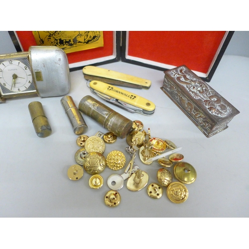 2031 - A travel clock, two pen knives, a lighter, buttons, etc.  **PLEASE NOTE THIS LOT IS NOT ELIGIBLE FOR... 